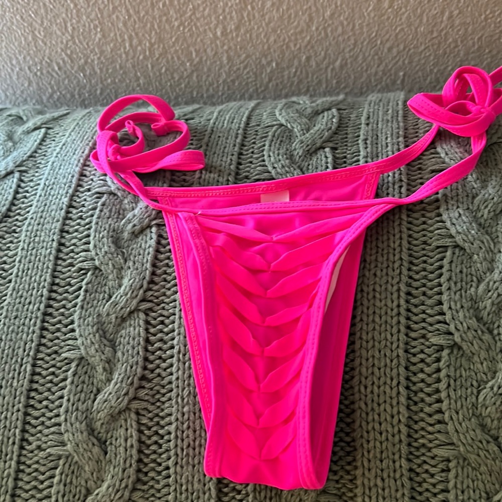 Cute hot pink bikini bottoms only.